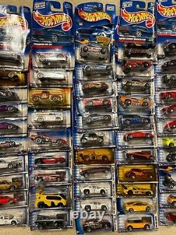 72 HOT WHEELS TOY CARS TRUCKS IN BUBBLE PACKS SOME WATER DAMAGE Late 1990's era